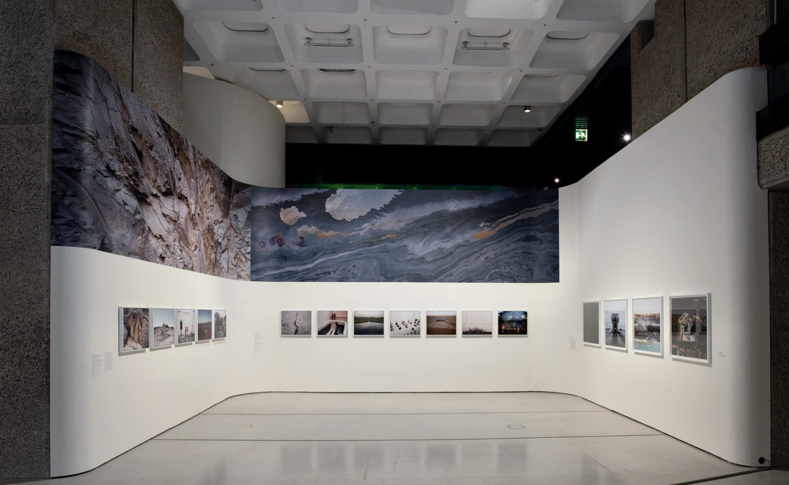 Large scale vinyl installation around exhibition space with vinyl text and bespoke painted titles