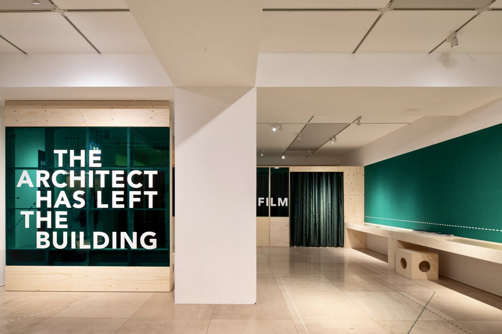 The Architect Has Left the Building Exhibition identity custom acrylic panel install cross exhibition flooring wayfinding and wall texts at Royal Institute of British Architects