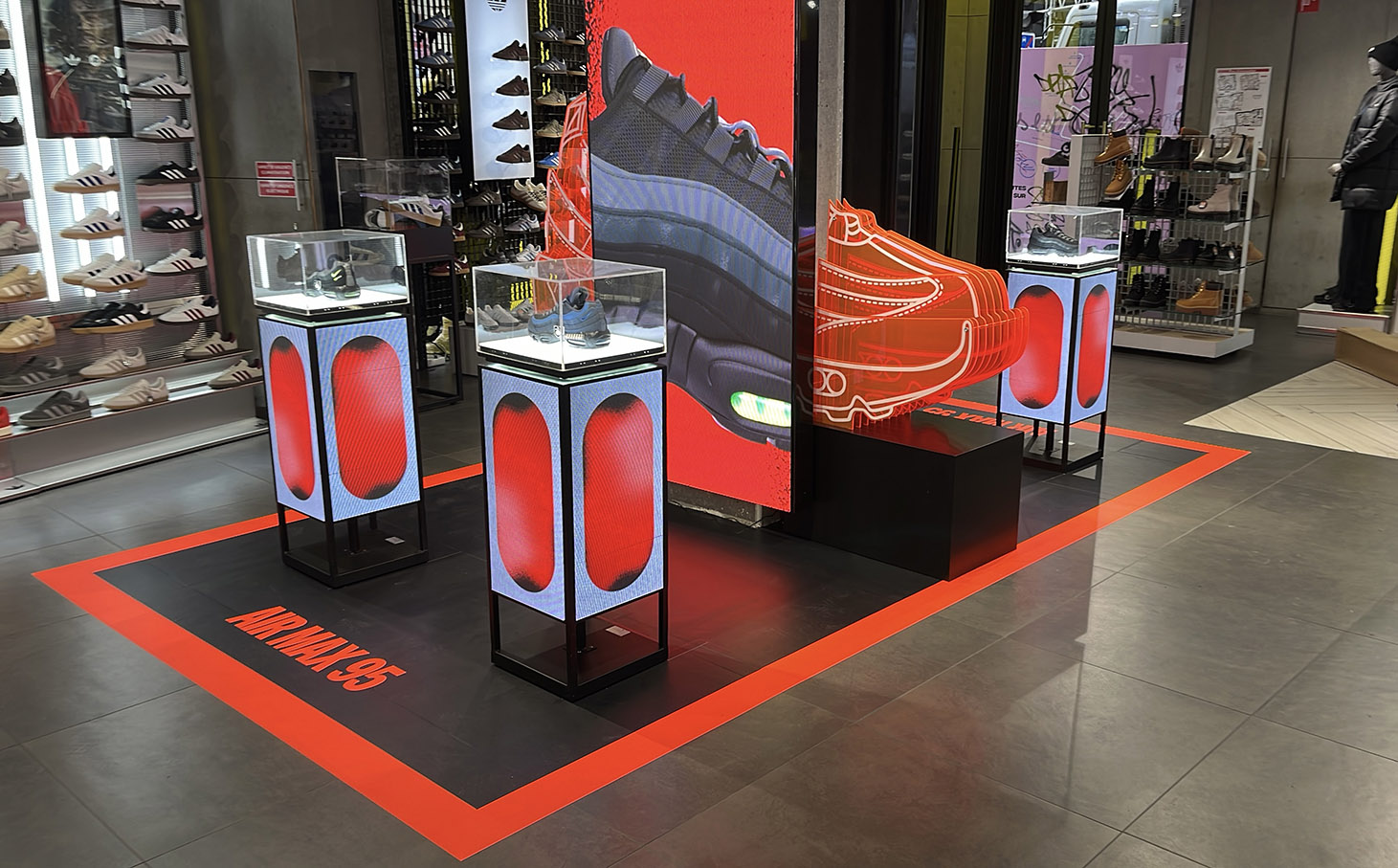 Illuminated display and flooring vinyl at JD Sports Paris Rue Rivoli