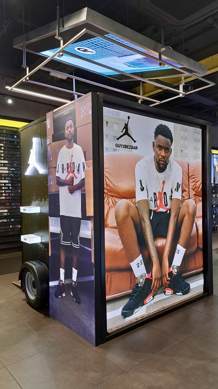 Vinyl lightbox skin and light-up podium display for Nike Dn8 campaign at JD Sports Rosny 2 Paris