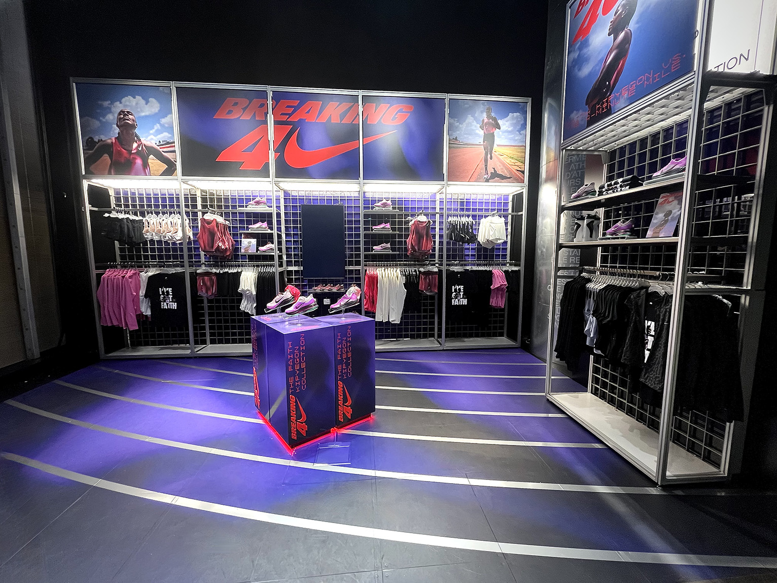 Breaking 4 campaign installation for Nike House of Innovation Paris with complete installation including podiums, background graphics and flooring