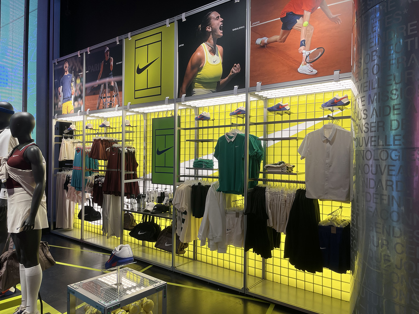 Roland Garros City Store display with backlit printed acrylic panels utilising existing store tooling at Nike House of Innovation Paris