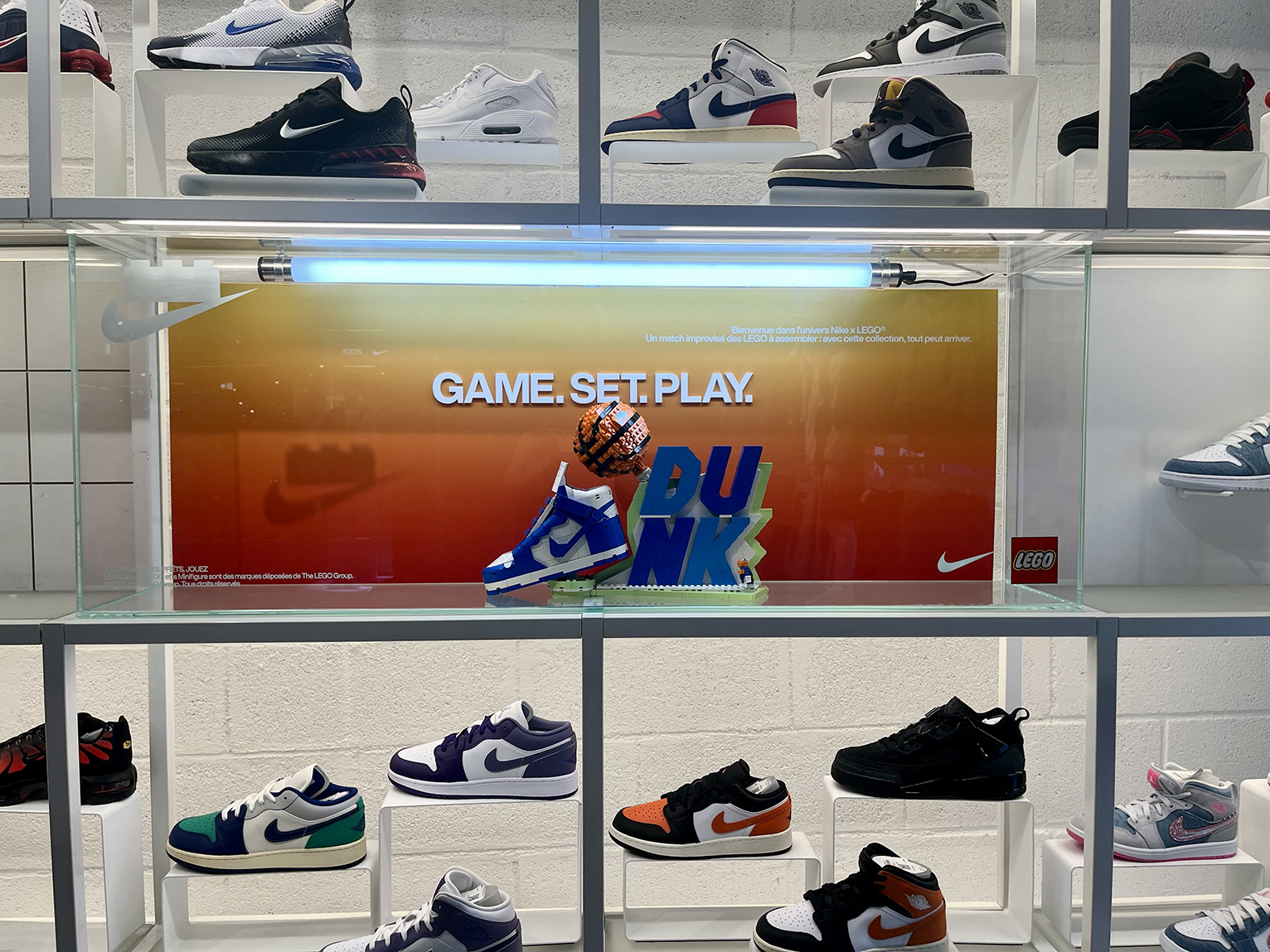 Vitrine installation for Lego and Nike campaign completed with other store installs for campaign at Nike House of Innovation Paris